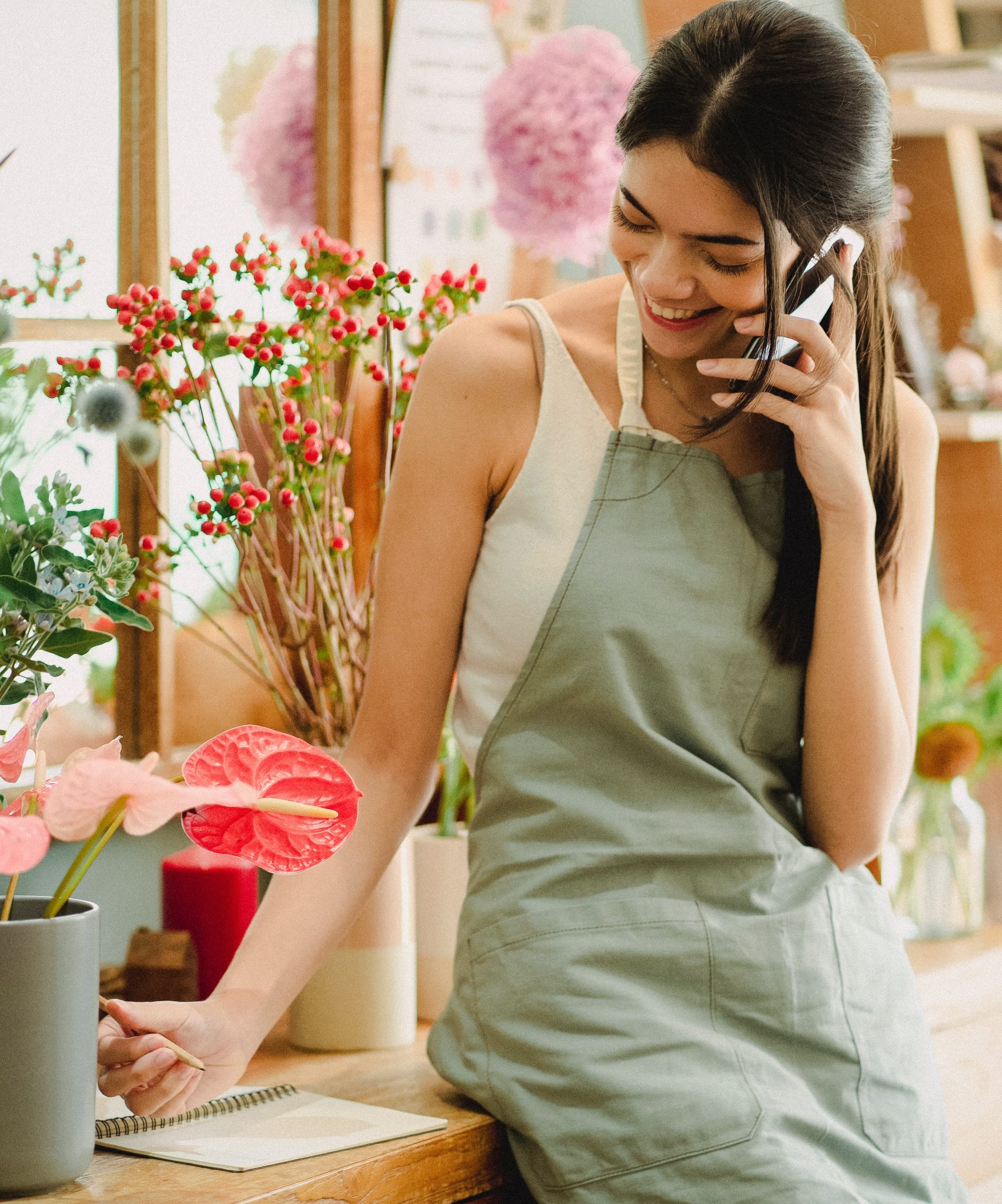 woman on the phone, representing a discovery call after clicking book a call